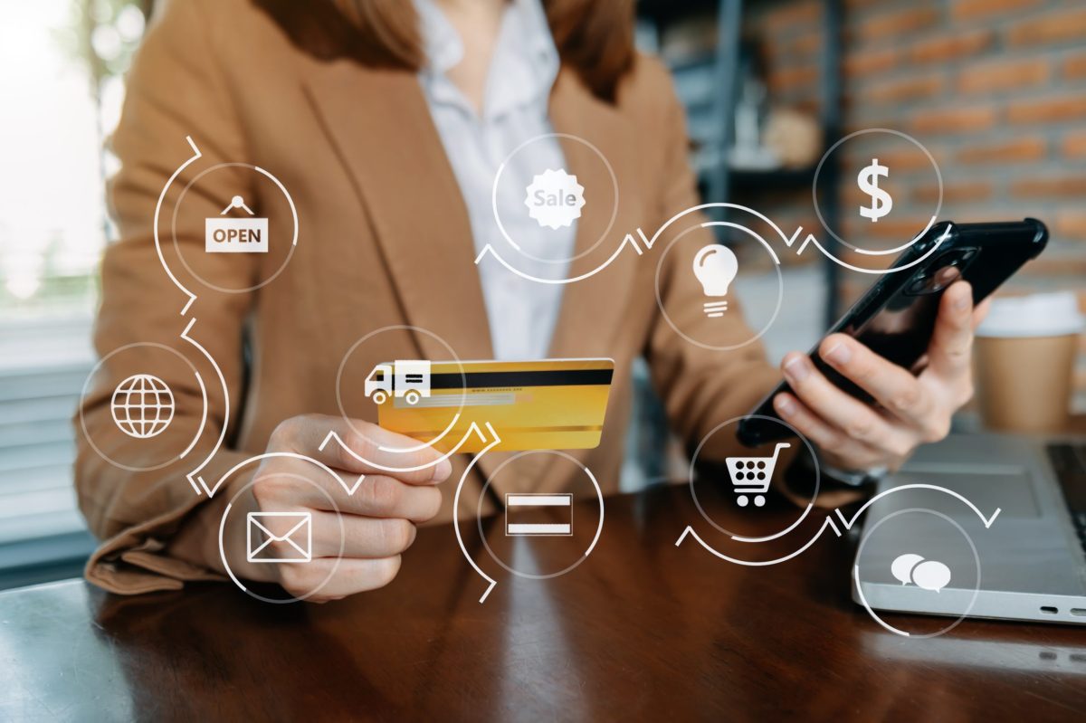 Business woman hands using smartphone and holding credit card si Top 5 Benefits of Omnichannel Customer Engagement for Business Success