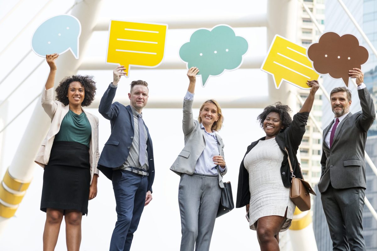 Successful business people with speech bubbles FAQs on Social Listening: Insights for Brands